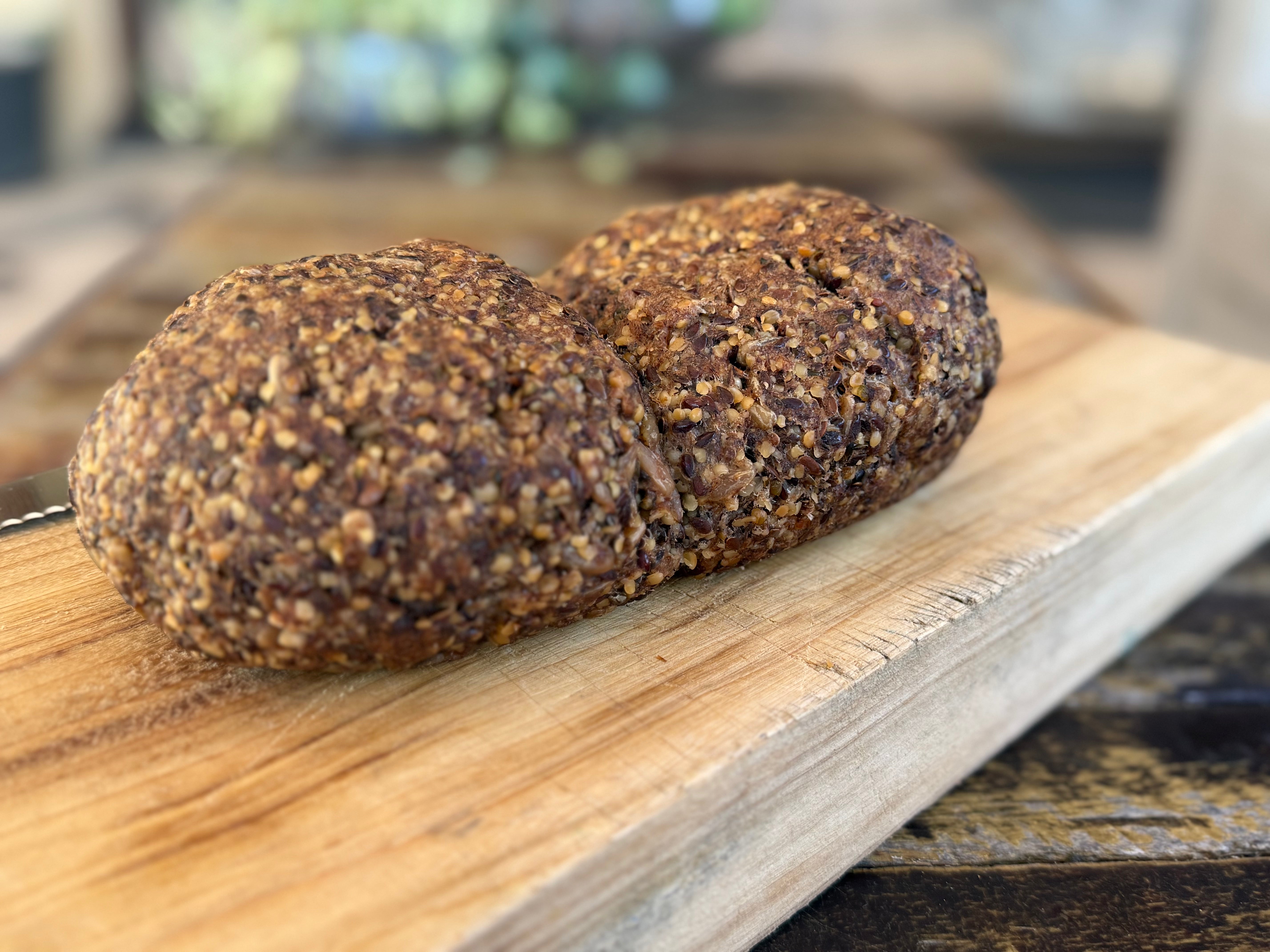 goodMix Bread Mix loaf of bread on a wooden cutting board