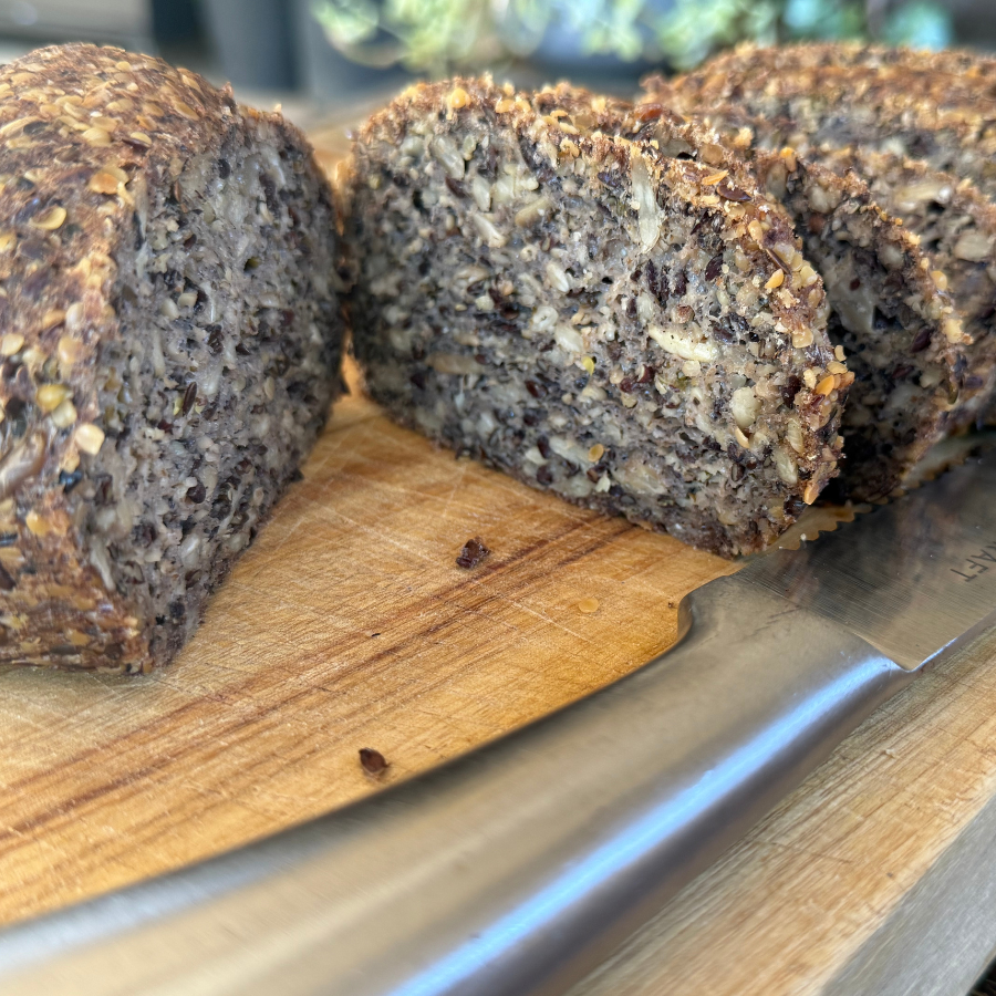goodMix Bread Mix sliced rye bread on a wooden cutting board