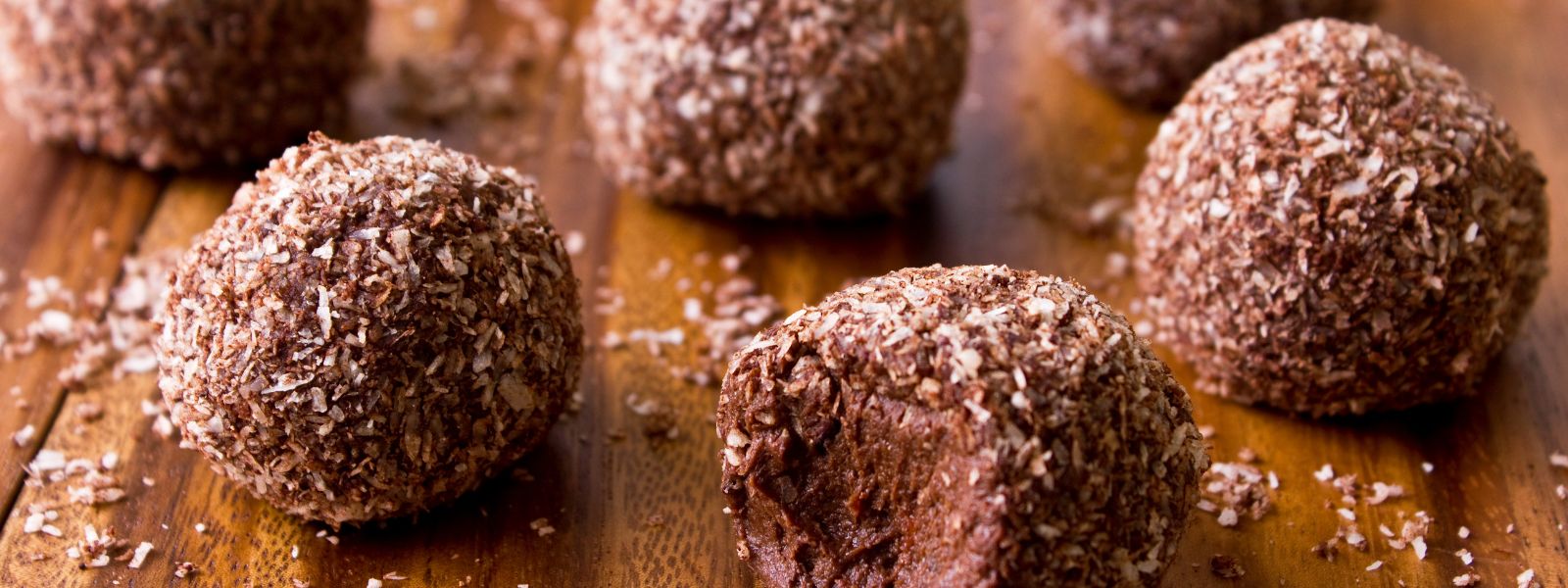 bliss balls on a wooden board are one of the healthy easter recipes in this blog