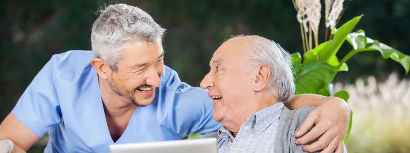 Older man chatting to middle aged man about natural factors for prostate health