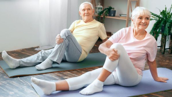 older man and woman exercising to increase vitality