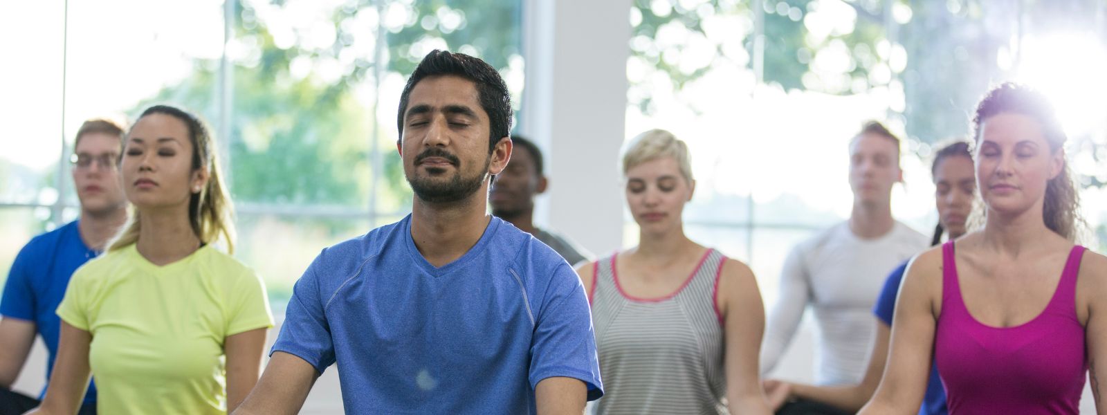 group meditating to support mental health