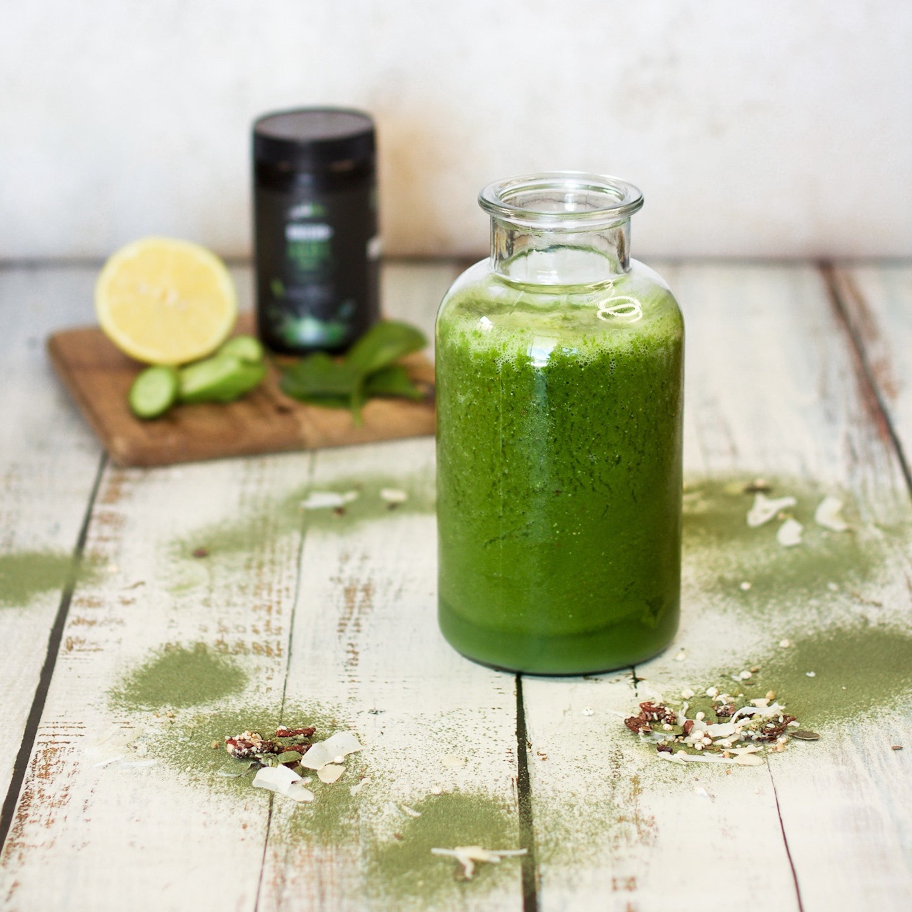 a jar of greens+aloe super greens powder when added to water